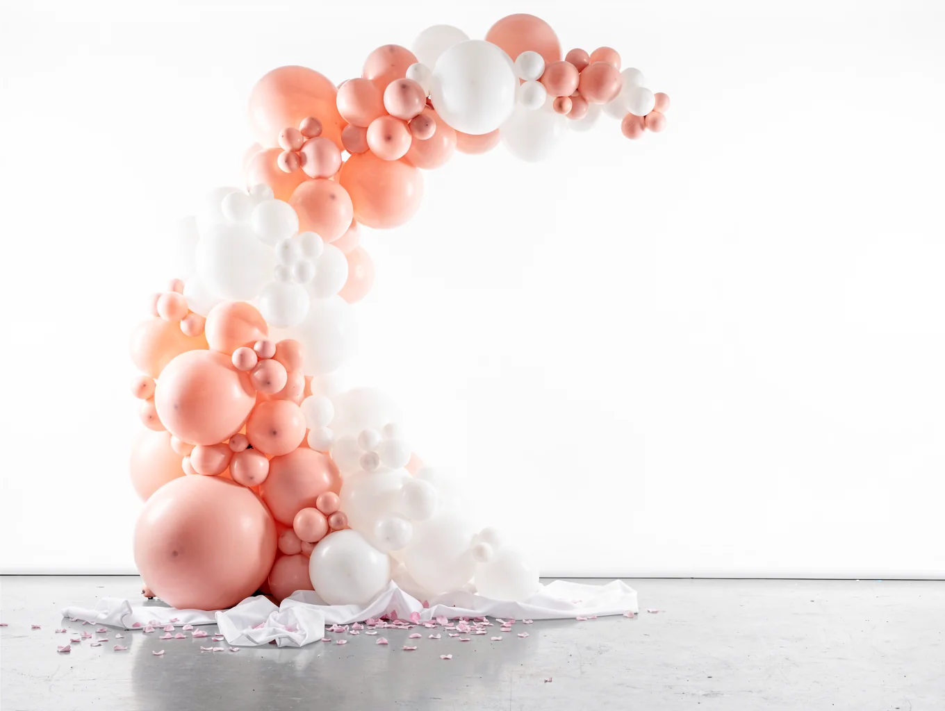 Vibrant signature hot pink gala balloon arch installation